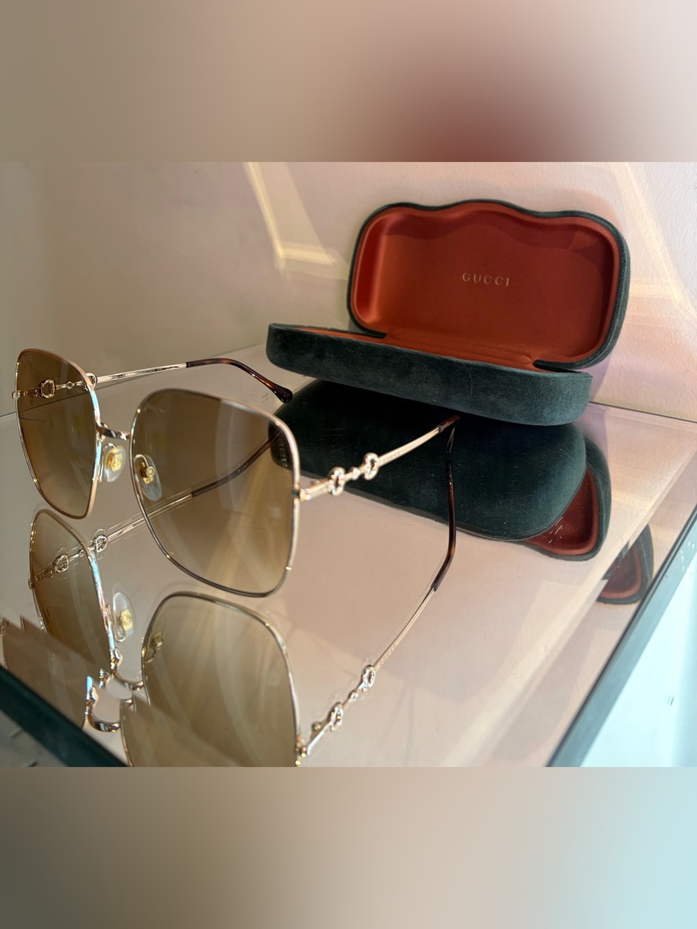 Gucci large rounded gold sunglasses